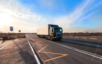 black-truck-moving-city-s-suburb_470606-207